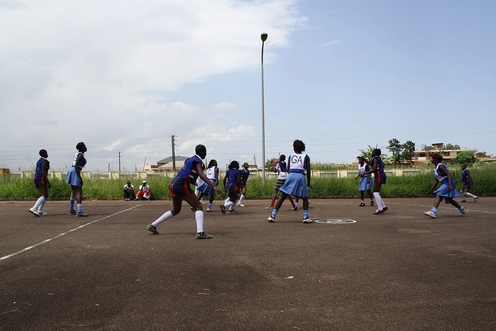 Girls playing netball outside Mandela National Stadium in Kampala